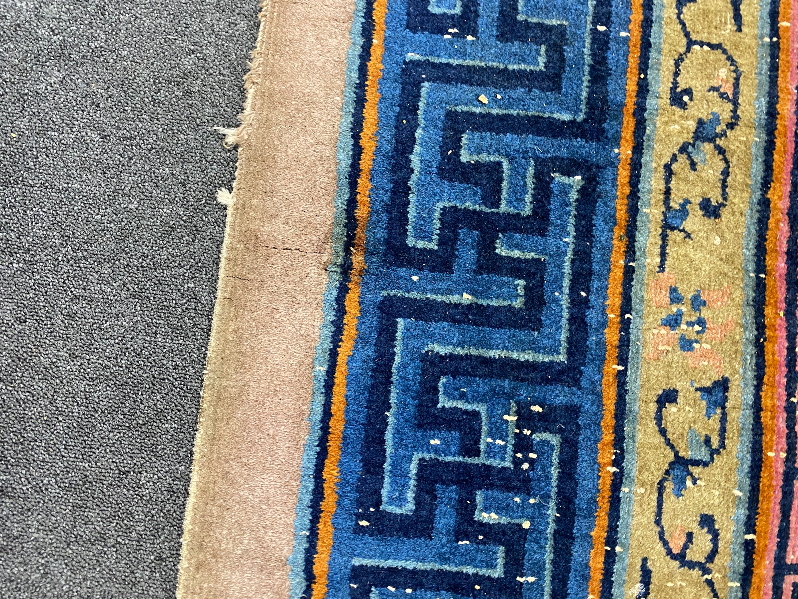 An early 20th century Chinese lilac ground carpet, 330 x 240cm